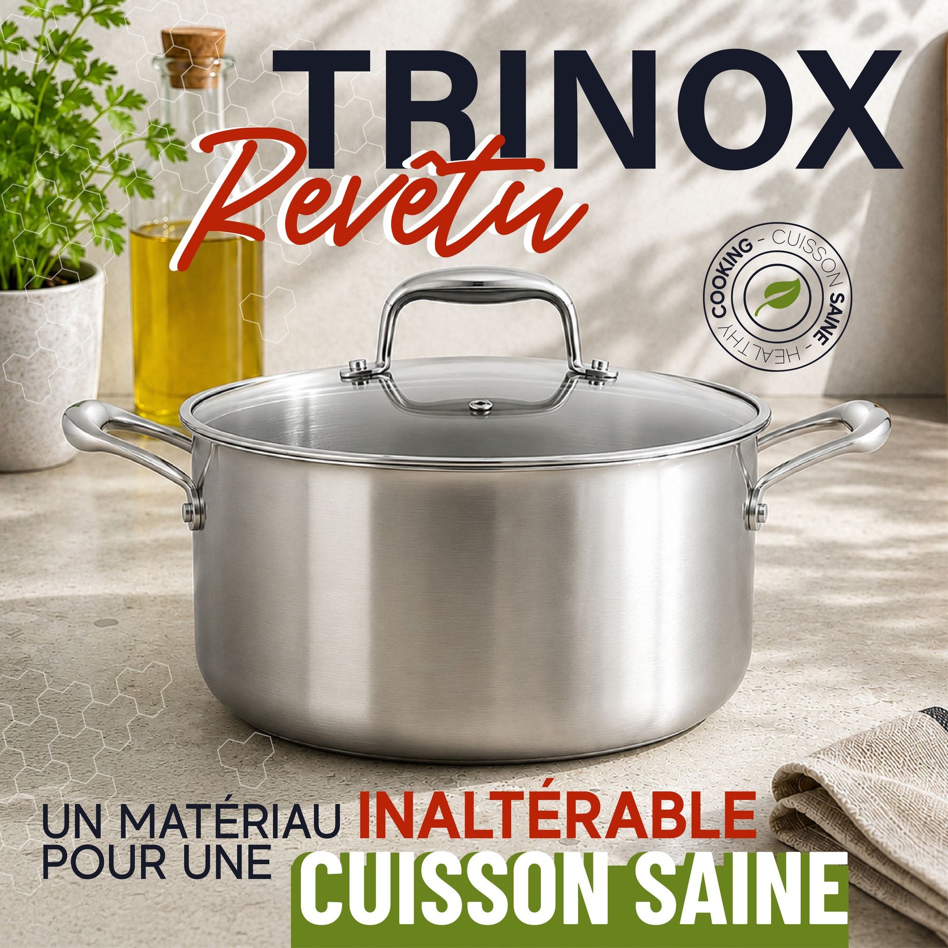 Faitout Trinox 20cm en inox avec couvercle verre, anses acier, posé sur plan de travail clair avec herbes et huile